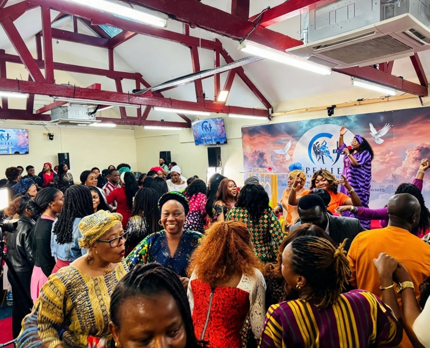 Congregation gathered with a worship leader at Peniel Church of Christ